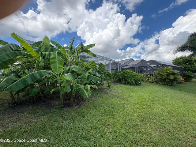 a backyard of a house with lots of green space