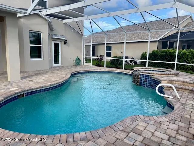a view of a backyard with swimming pool