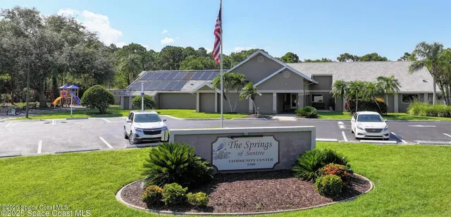 a view of a house with swimming pool and a yard
