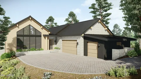 an aerial view of a house with a yard and potted plants