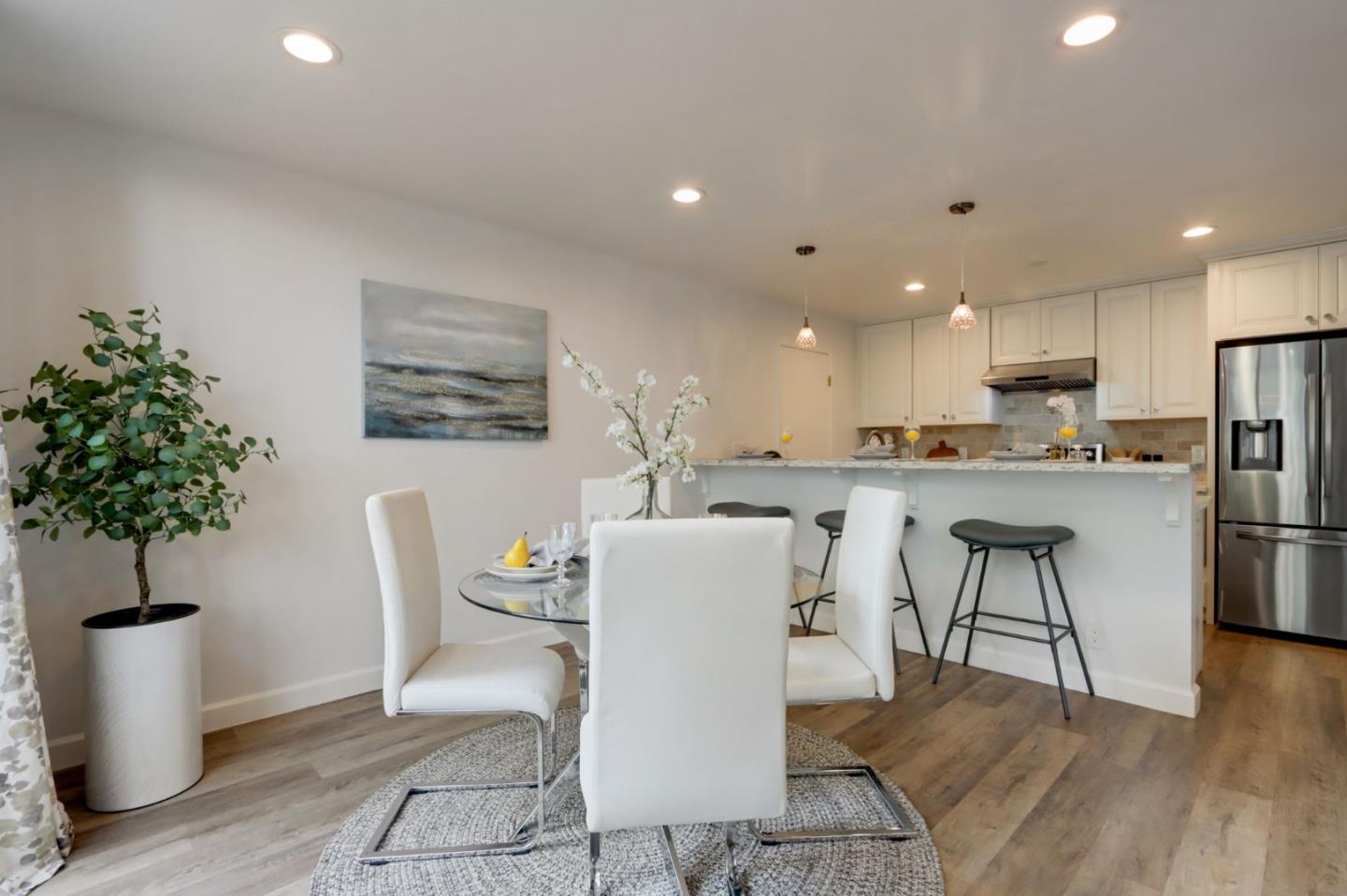 1653 Albatross Drive Sunnyvale, CA 94087 - Photo 11 of 44 a living room with furniture a potted plant and kitchen view