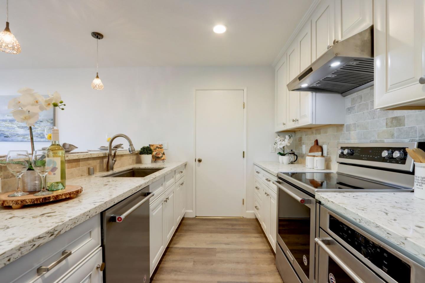 1653 Albatross Drive Sunnyvale, CA 94087 - Photo 15 of 44 a kitchen with stainless steel appliances granite countertop a sink and stove