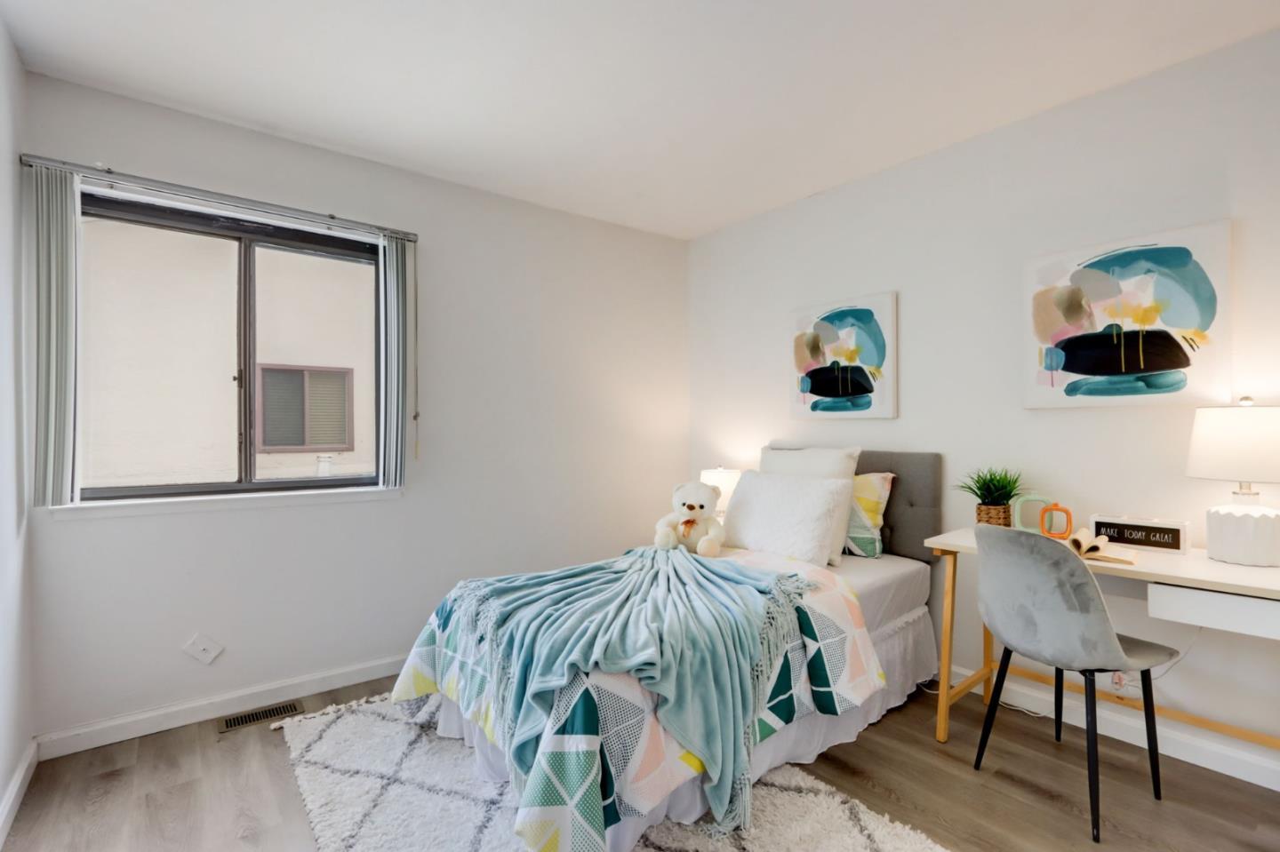 1653 Albatross Drive Sunnyvale, CA 94087 - Photo 19 of 44 a bedroom with a bed and a window