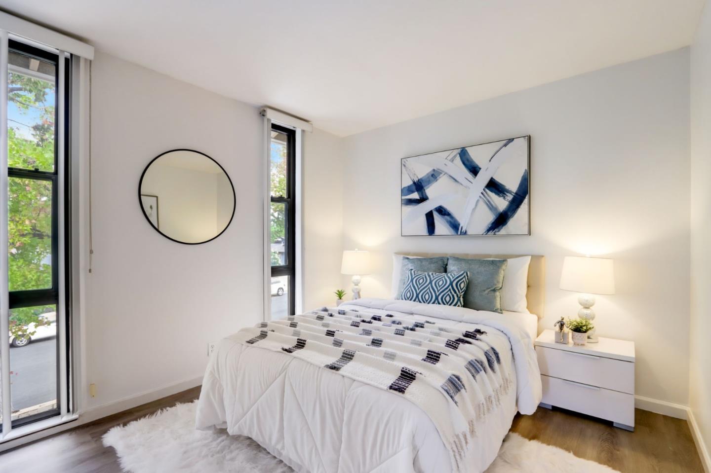 1653 Albatross Drive Sunnyvale, CA 94087 - Photo 21 of 44 a bedroom with a bed and a painting on the wall