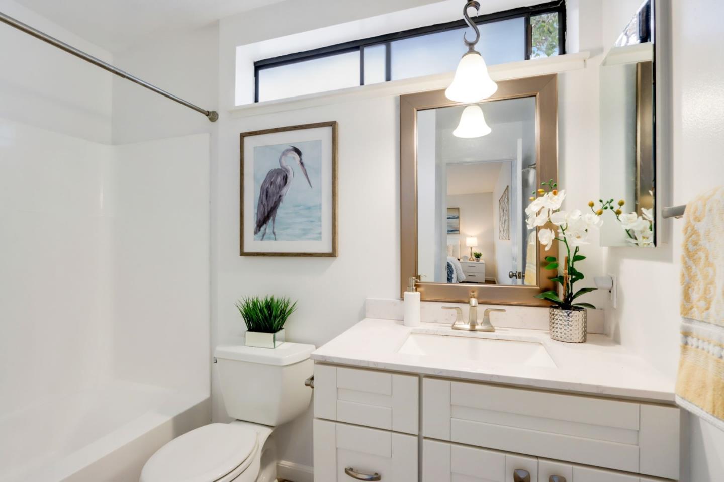 1653 Albatross Drive Sunnyvale, CA 94087 - Photo 27 of 44 a bathroom with a sink vanity granite and toilet