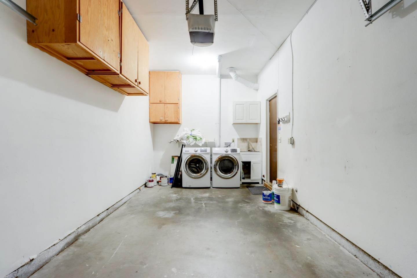 1653 Albatross Drive Sunnyvale, CA 94087 - Photo 28 of 44 a view of a hallway with washer and dryer