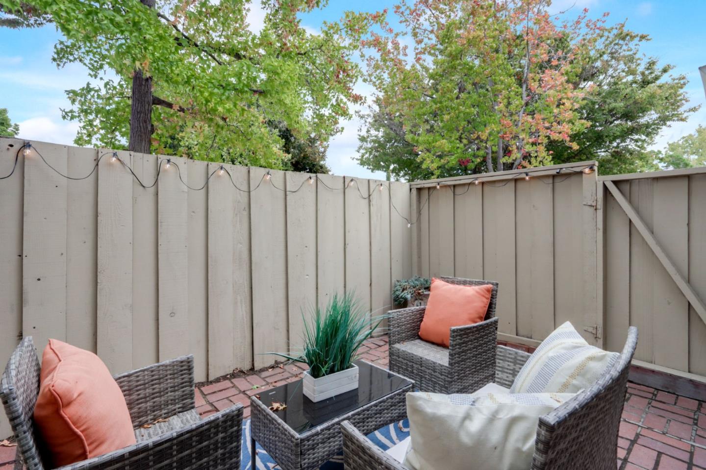 1653 Albatross Drive Sunnyvale, CA 94087 - Photo 31 of 44 a backyard of a house with lawn chairs and a barbeque