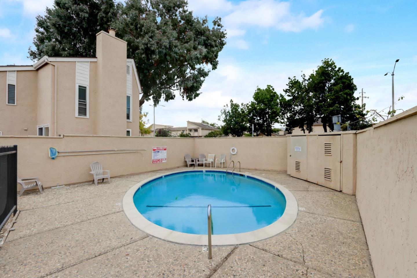 1653 Albatross Drive Sunnyvale, CA 94087 - Photo 34 of 44 a view of a swimming pool with a yard