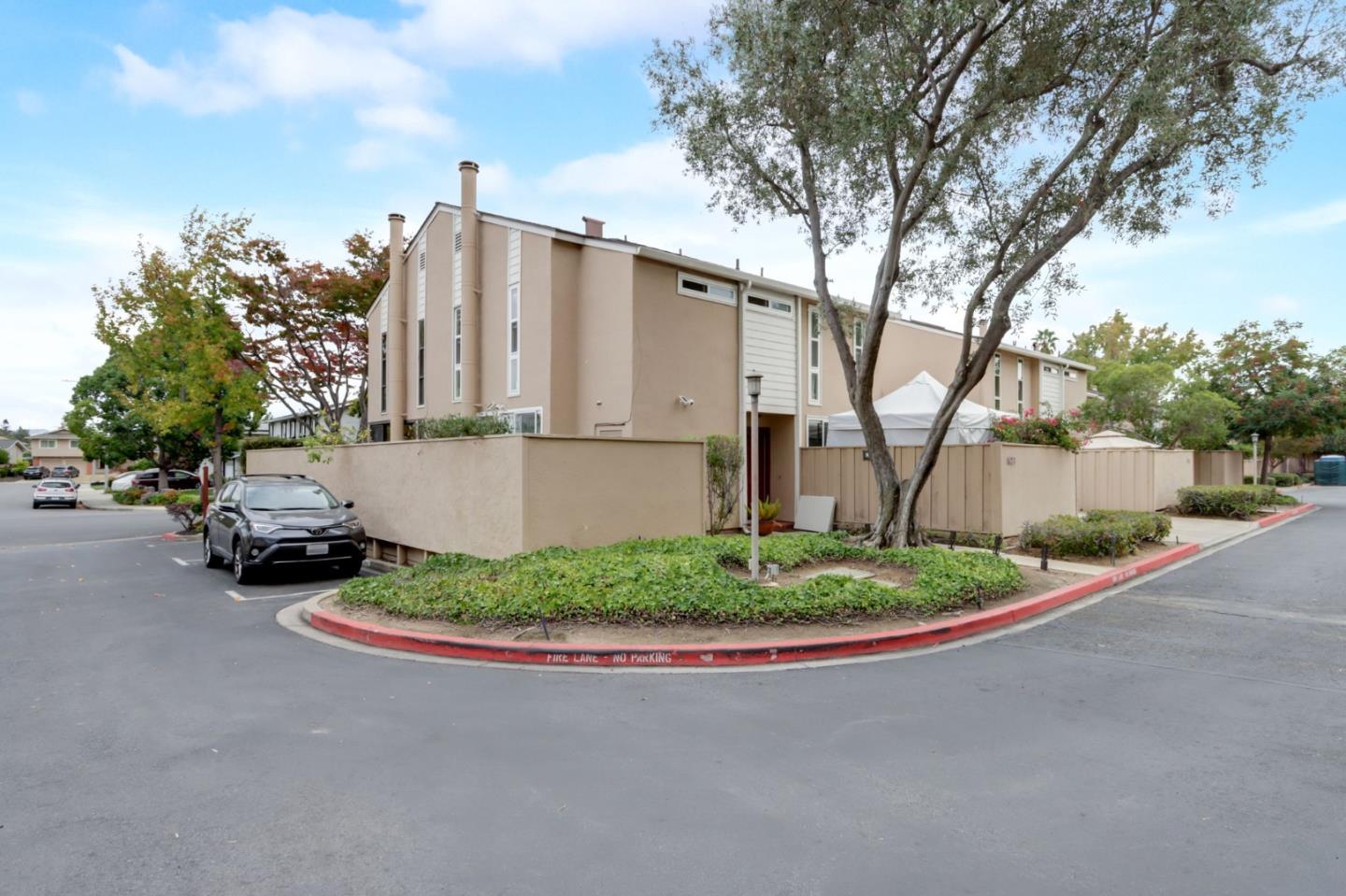 1653 Albatross Drive Sunnyvale, CA 94087 - Photo 35 of 44 a view of a street with a building and trees in the background