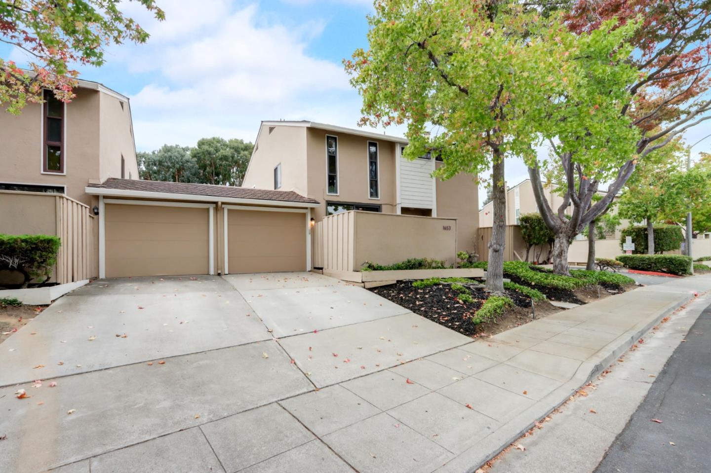 1653 Albatross Drive Sunnyvale, CA 94087 - Photo 4 of 44 a view of a white house with a yard and potted plants
