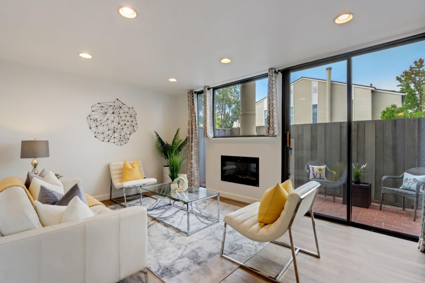 1653 Albatross Drive Sunnyvale, CA 94087 - Photo 6 of 44 a living room with furniture and a fireplace