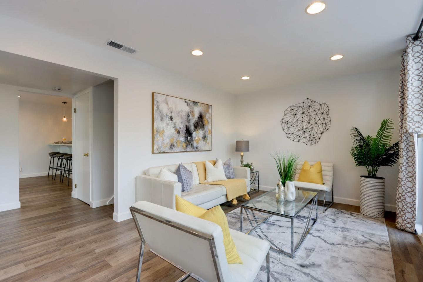 1653 Albatross Drive Sunnyvale, CA 94087 - Photo 7 of 44 a living room with furniture and a potted plant