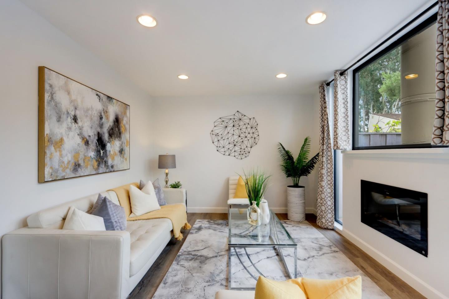 1653 Albatross Drive Sunnyvale, CA 94087 - Photo 8 of 44 a living room with furniture a fireplace and a large window