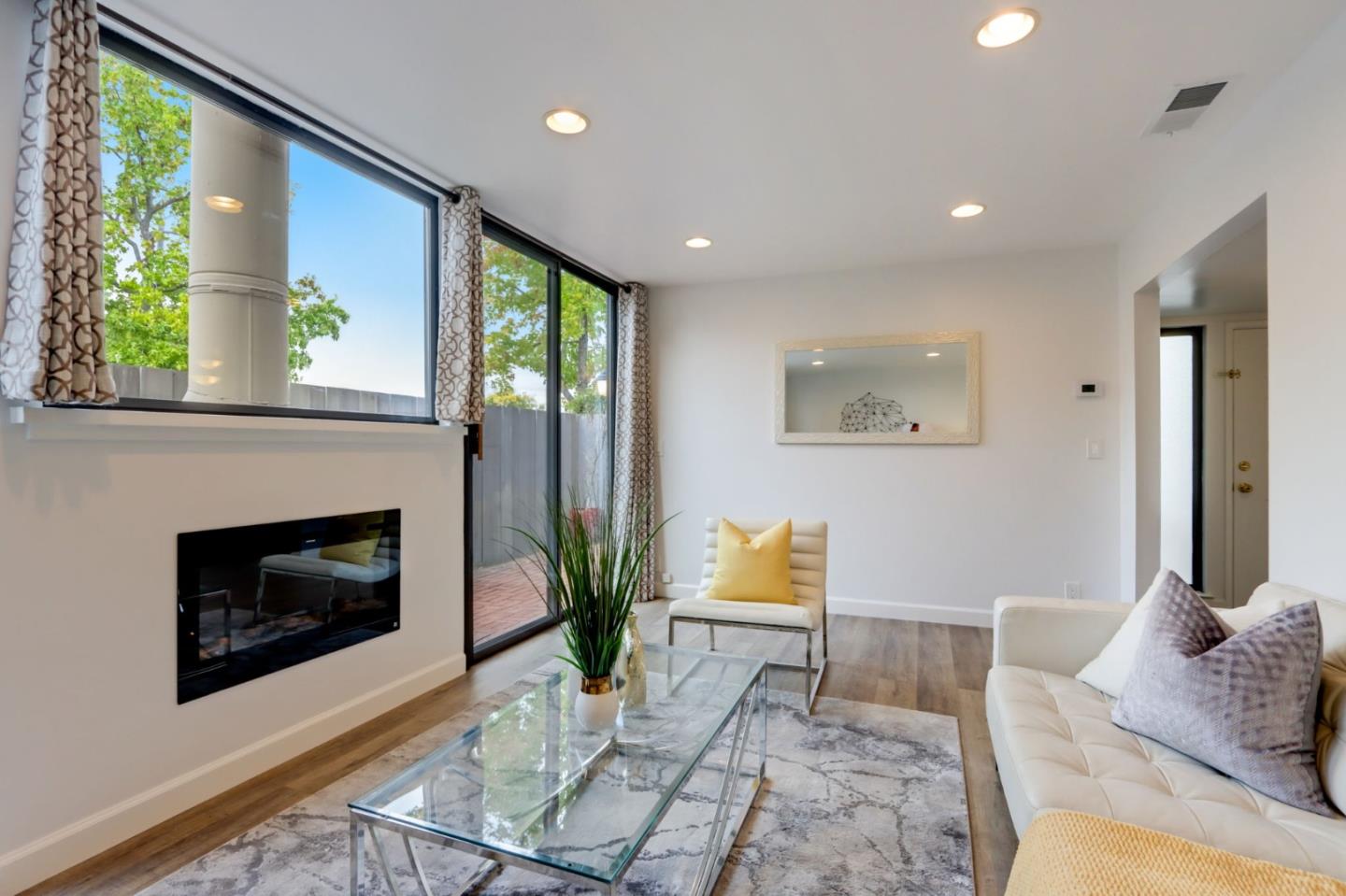 1653 Albatross Drive Sunnyvale, CA 94087 - Photo 9 of 44 a living room with furniture and a fireplace