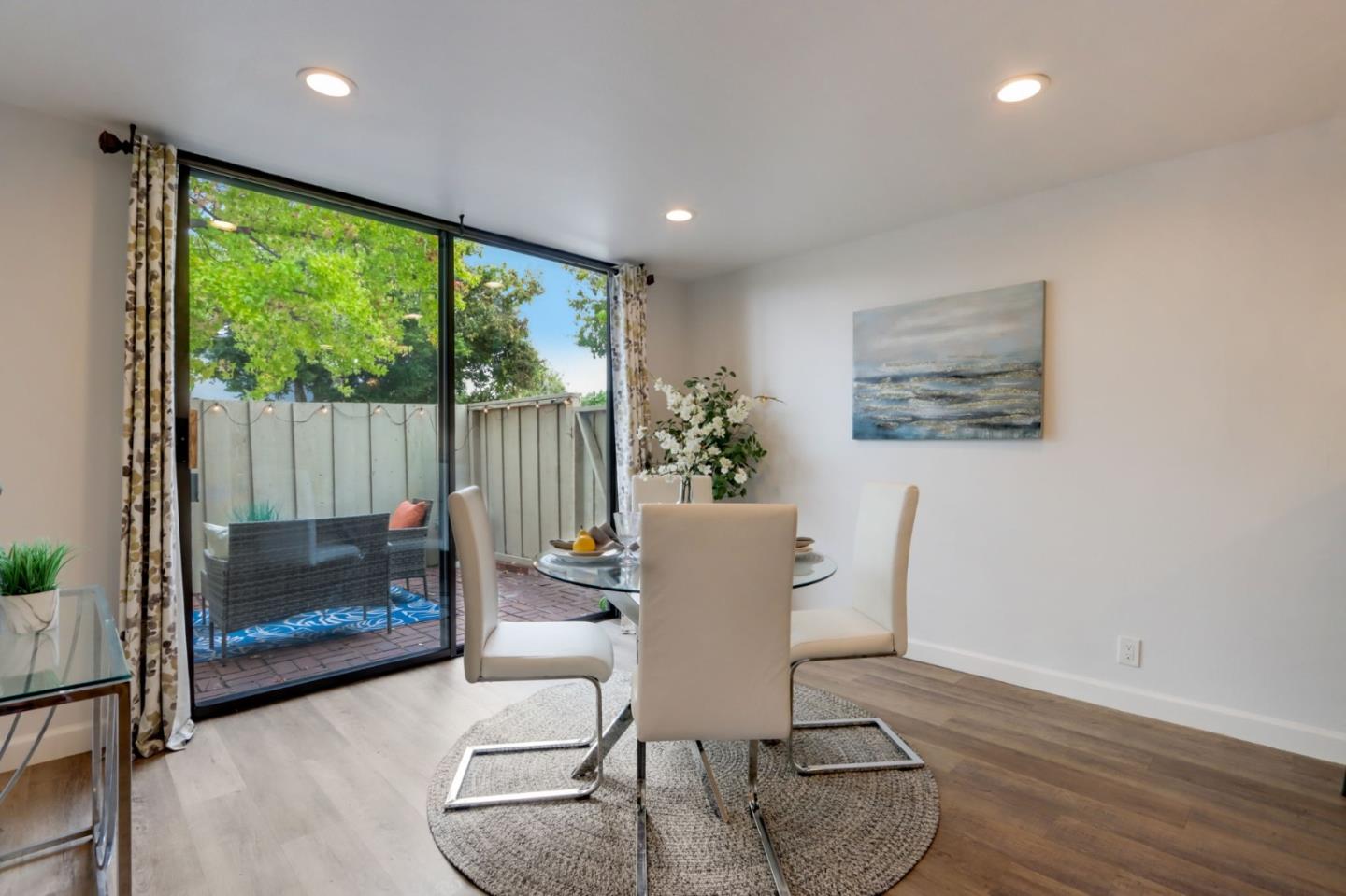 1653 Albatross Drive Sunnyvale, CA 94087 - Photo 10 of 44 a living room with furniture and a floor to ceiling window