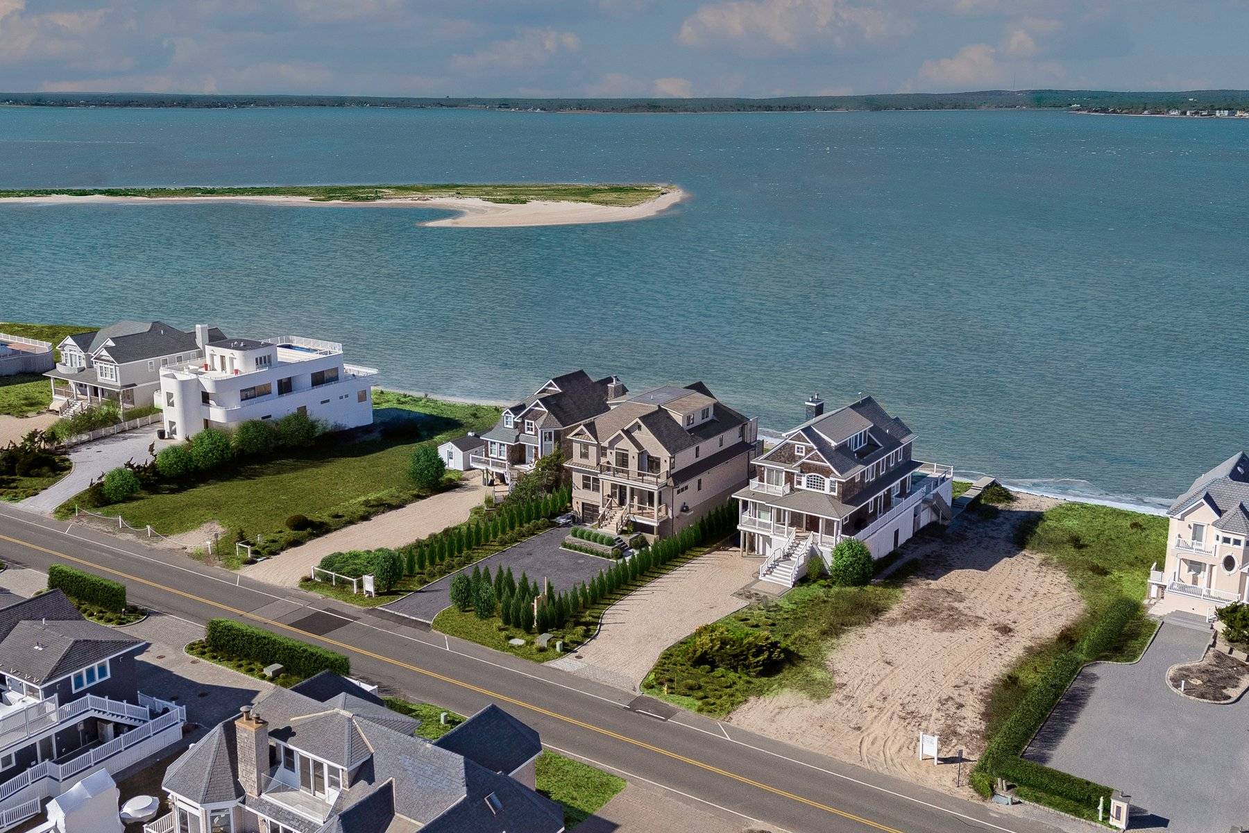 686 Dune Road Westhampton Beach, NY 11978 - Photo 2 of 37 an aerial view of a house with a lake view