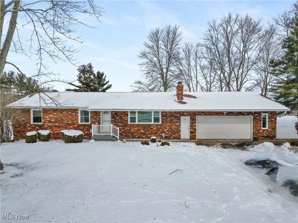 6059 Branch Road Medina, OH 44256 - Photo 1 of 39 Single story home with brick siding, a chimney, and an attached garage