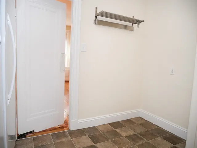 a view of a room with rack on the wall