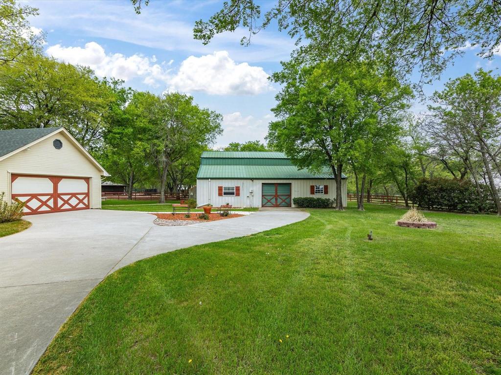 1990 Ripy Road Krum, TX 76249 - Photo 3 of 40 a front view of a house with yard and green space