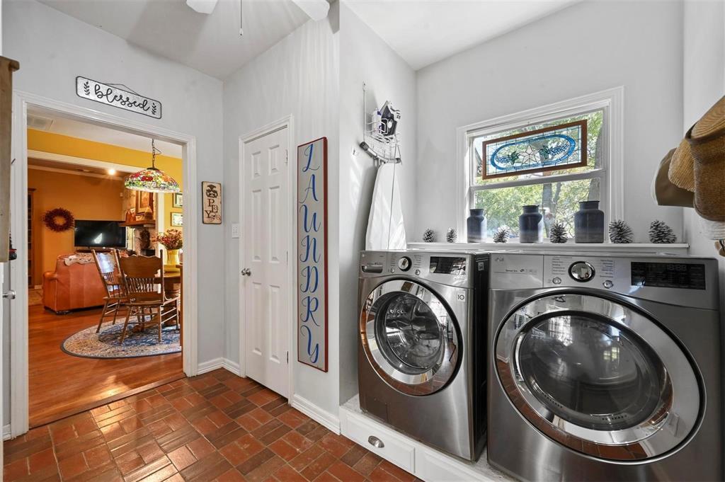 1990 Ripy Road Krum, TX 76249 - Photo 31 of 40 a view of a bedroom with washer and dryer