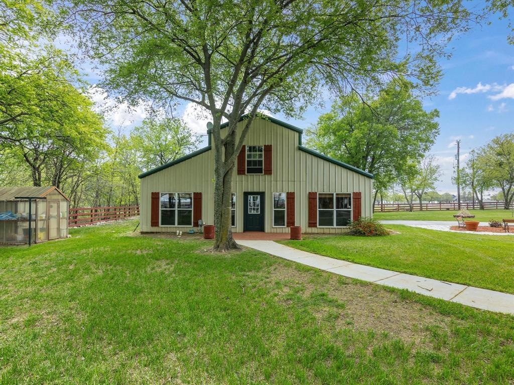 1990 Ripy Road Krum, TX 76249 - Photo 33 of 40 a front view of house with yard and green space