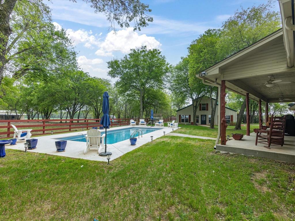 1990 Ripy Road Krum, TX 76249 - Photo 36 of 40 a view of a house with backyard and sitting area