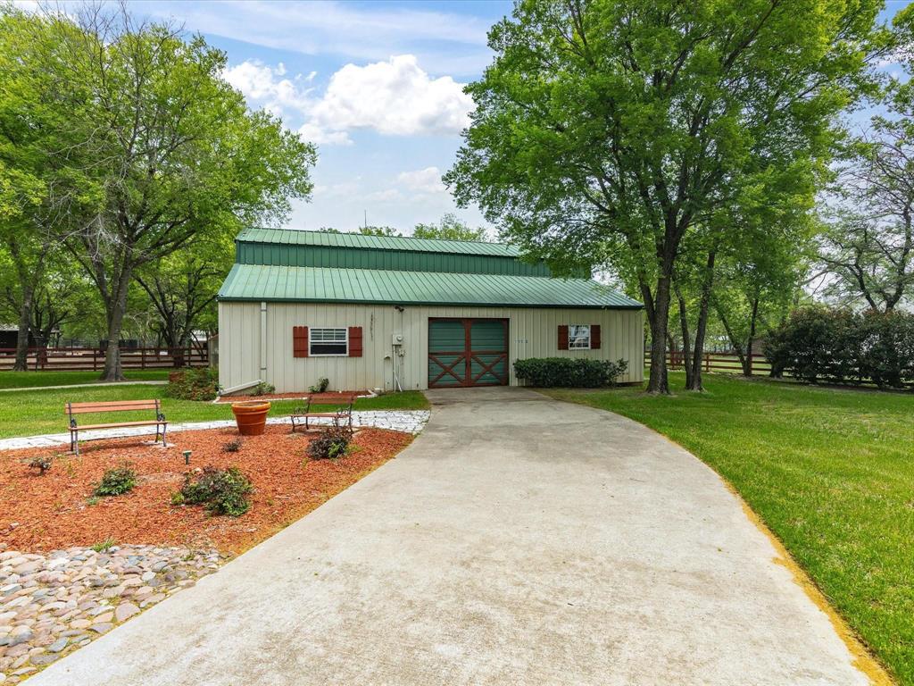 1990 Ripy Road Krum, TX 76249 - Photo 4 of 40 front view of a house with a patio