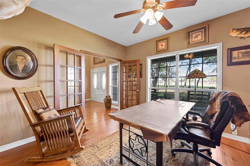 1990 Ripy Road Krum, TX 76249 - Photo 10 of 40 a view of a dining room with furniture wooden floor and chandelier