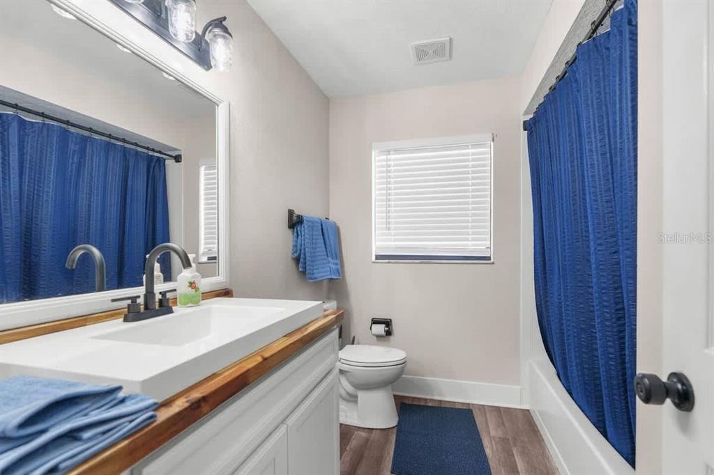 13501 Whitby Road Hudson, FL 34667 - Photo 11 of 25 a bathroom with a sink and a large mirror