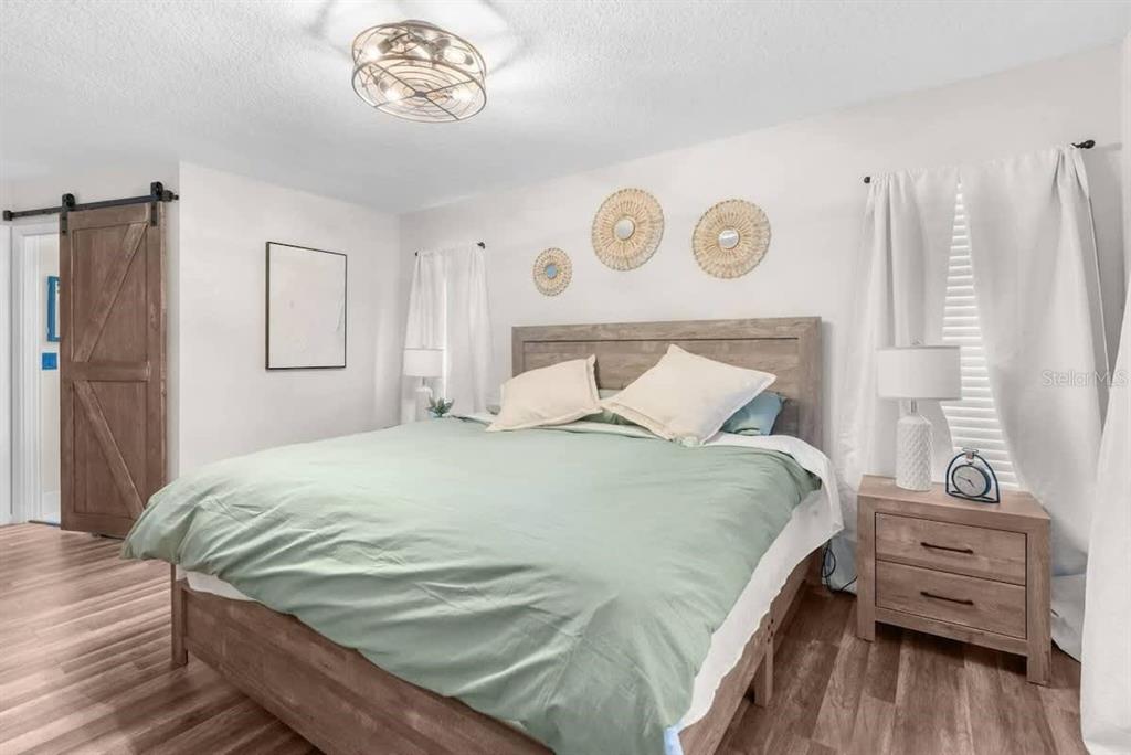 13501 Whitby Road Hudson, FL 34667 - Photo 16 of 25 a bedroom with a bed and a window