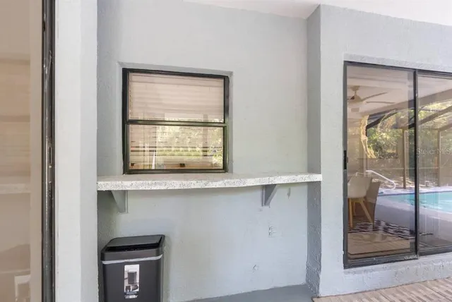 a kitchen with a window cabinets and outdoor view