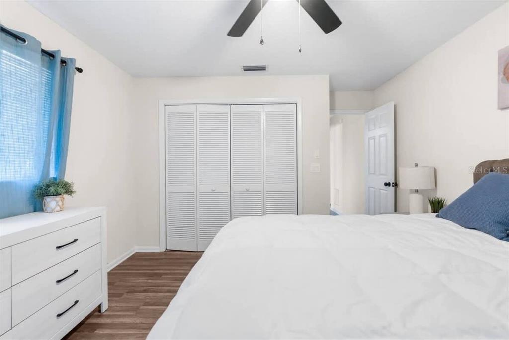 13501 Whitby Road Hudson, FL 34667 - Photo 19 of 25 a bedroom with a bed and a dresser