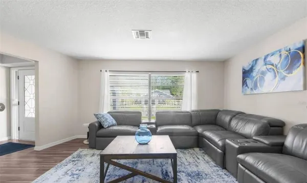 a living room with furniture and a large window