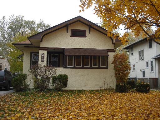 216 Olmsted Road Riverside, IL 60546 - Photo 1 of 1 a front view of a house with garden