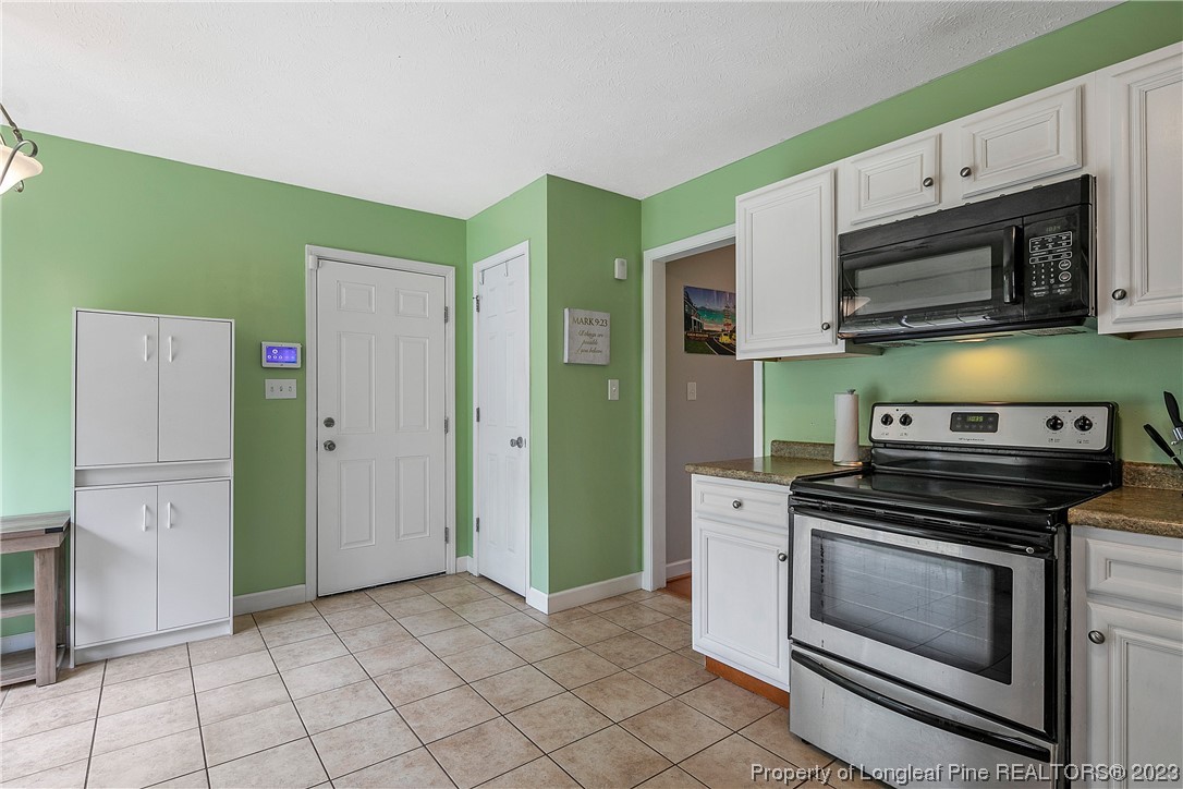 250 Pender Road Spring Lake, NC 28390 - Photo 15 of 50 a kitchen with cabinets and steel stainless steel appliances