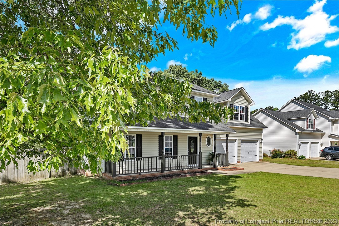 250 Pender Road Spring Lake, NC 28390 - Photo 2 of 50 a front view of a house with a garden