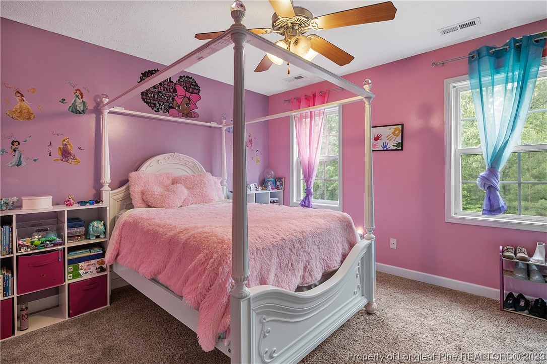 250 Pender Road Spring Lake, NC 28390 - Photo 43 of 50 a bedroom with a bed and a window