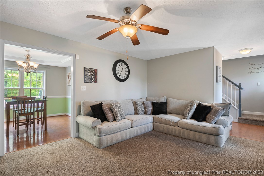 250 Pender Road Spring Lake, NC 28390 - Photo 8 of 50 a living room with furniture wooden floor and a clock
