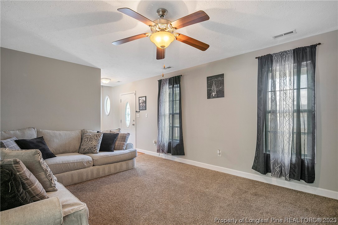 250 Pender Road Spring Lake, NC 28390 - Photo 9 of 50 a living room with furniture and a window