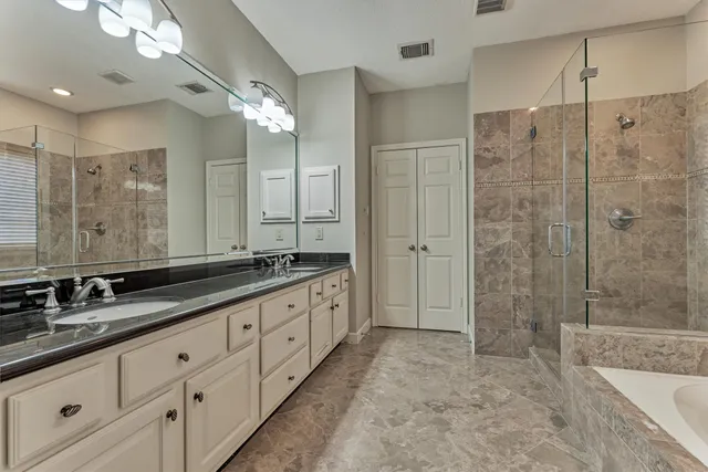 a bathroom with a bath tub and a shower