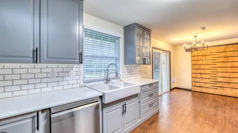 a kitchen with a sink and cabinets