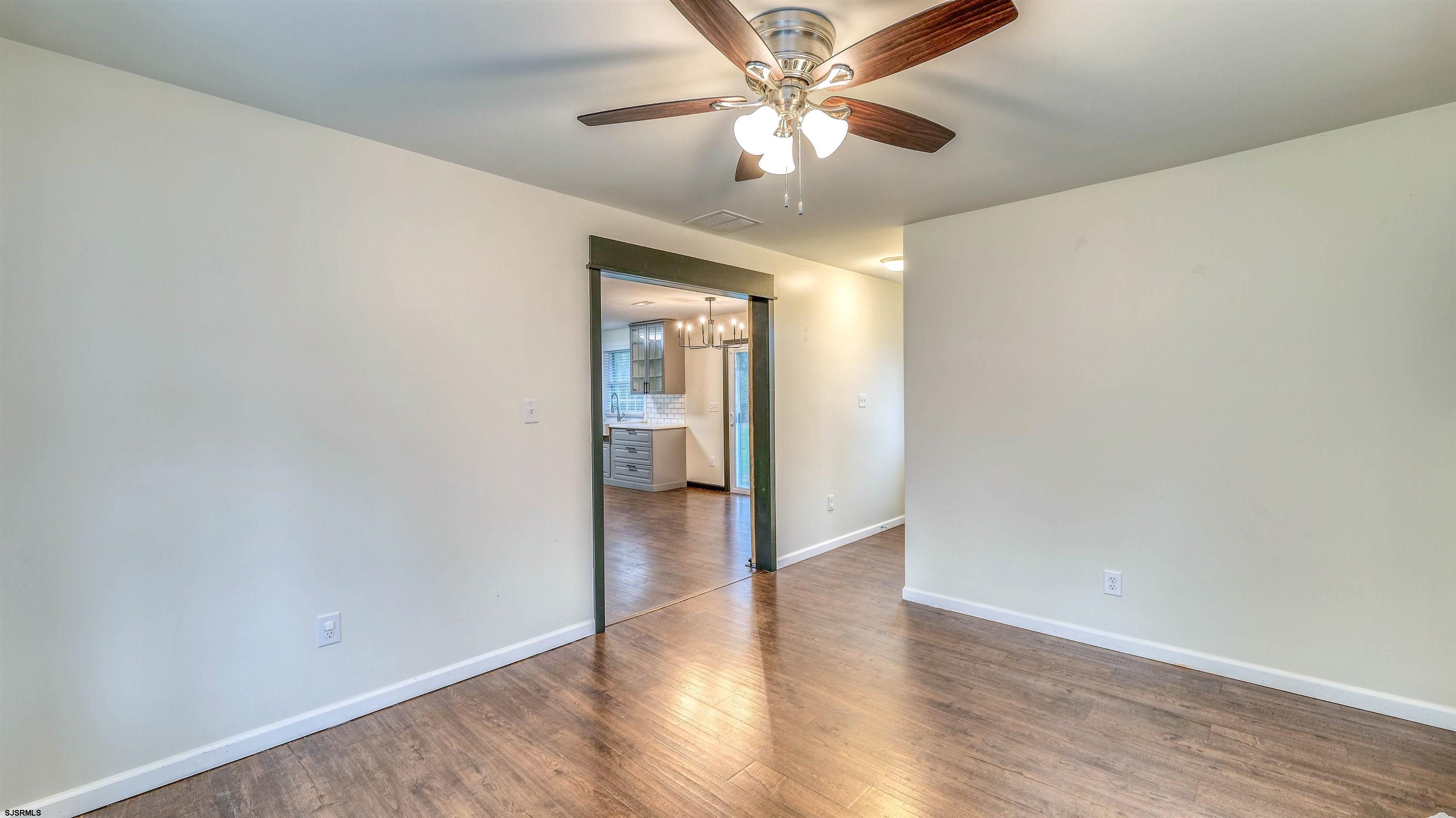 1048 Ocean Heights Avenue Egg Harbor Township, NJ 08234 - Photo 14 of 30 an empty room with wooden floor a ceiling fan and closet