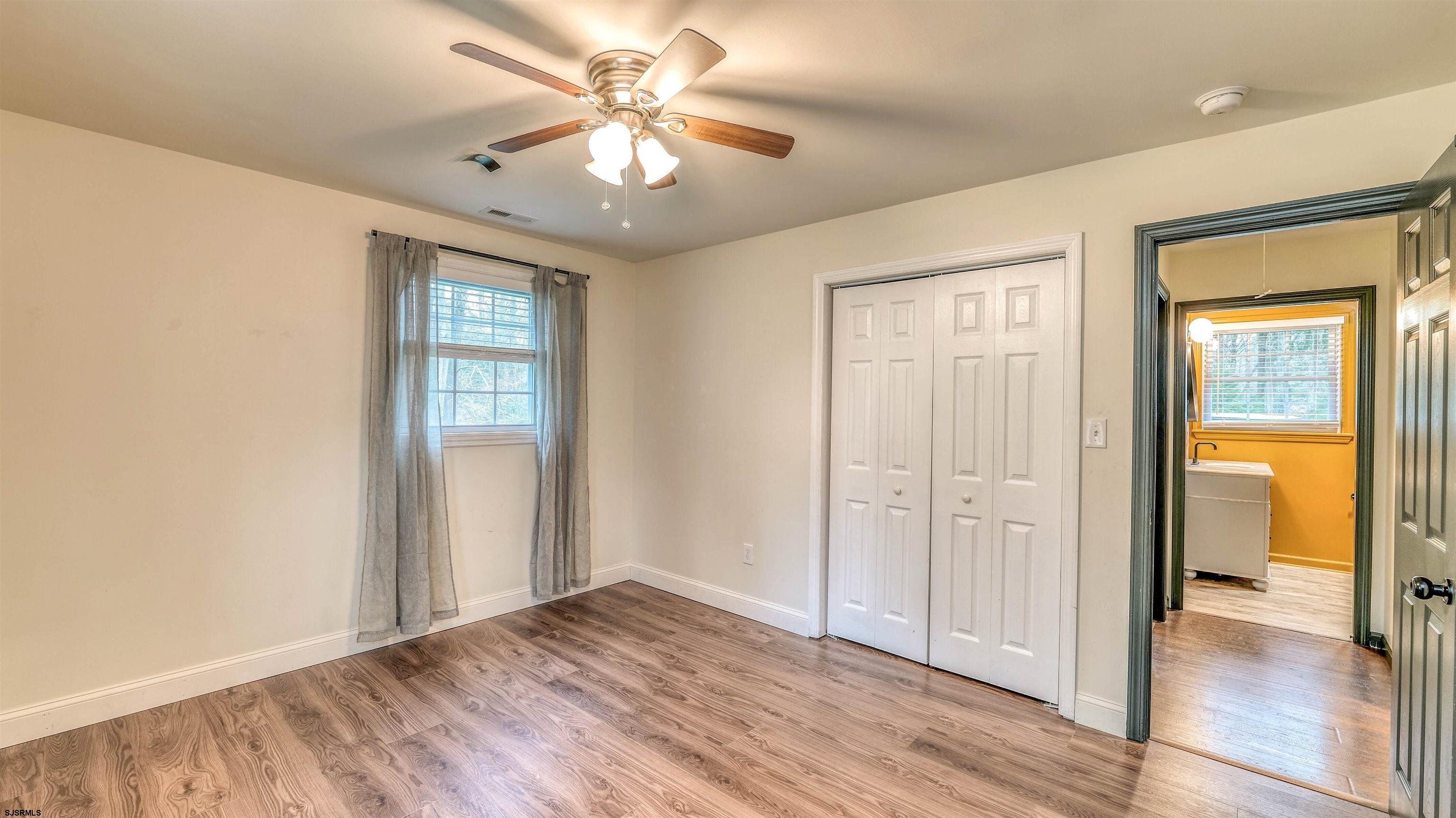1048 Ocean Heights Avenue Egg Harbor Township, NJ 08234 - Photo 20 of 30 wooden floor in an empty room with a window