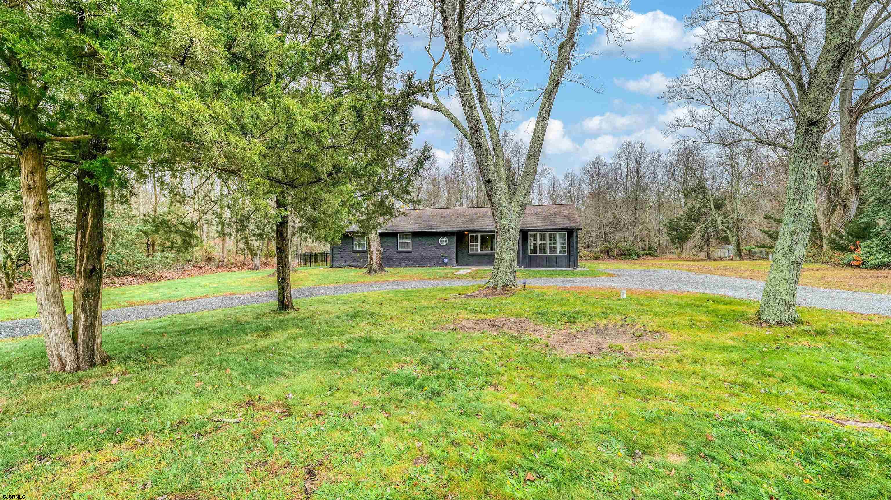 1048 Ocean Heights Avenue Egg Harbor Township, NJ 08234 - Photo 2 of 30 a front view of a house with a yard and trees