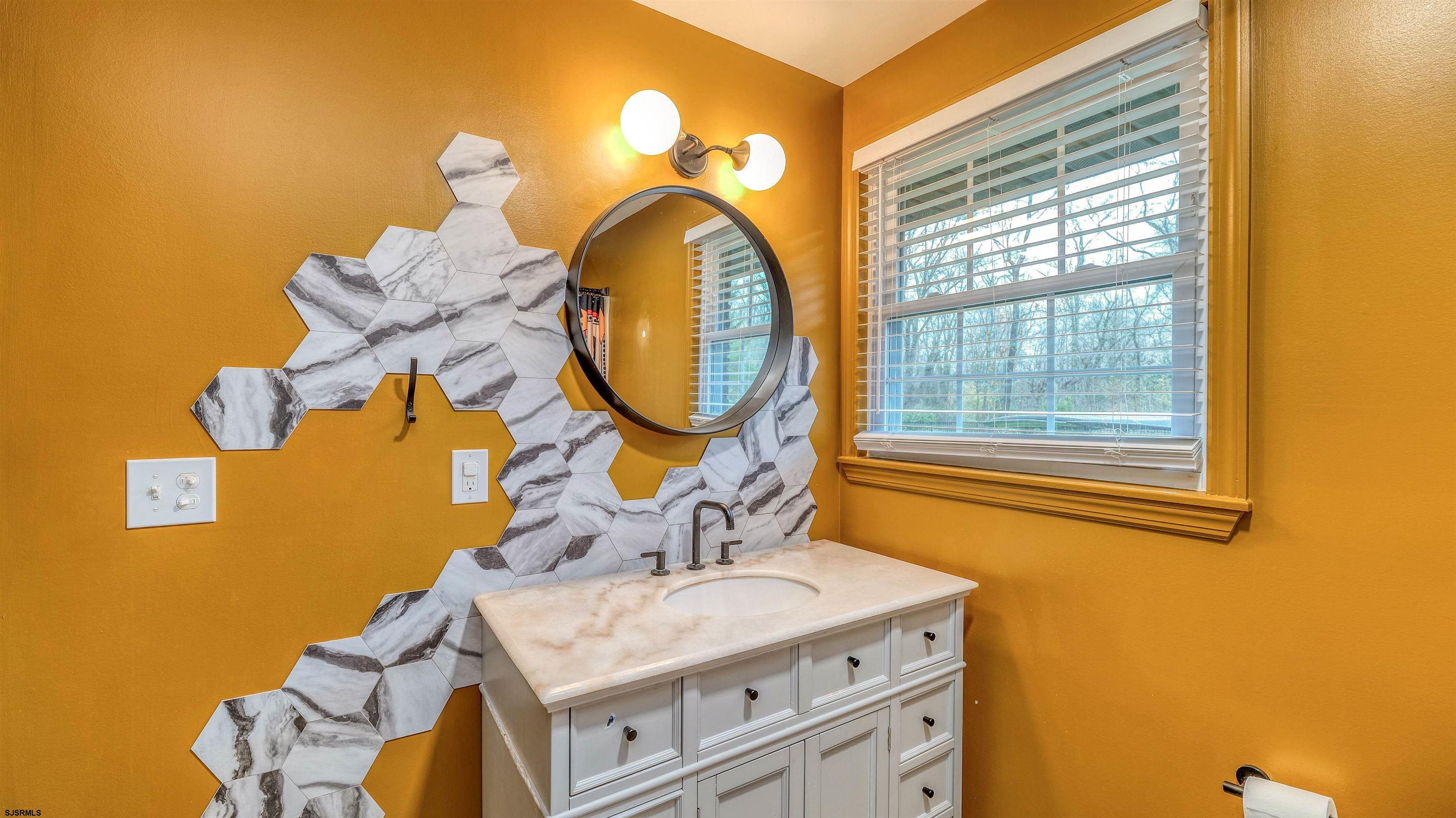 1048 Ocean Heights Avenue Egg Harbor Township, NJ 08234 - Photo 23 of 30 a bathroom with a sink and a mirror