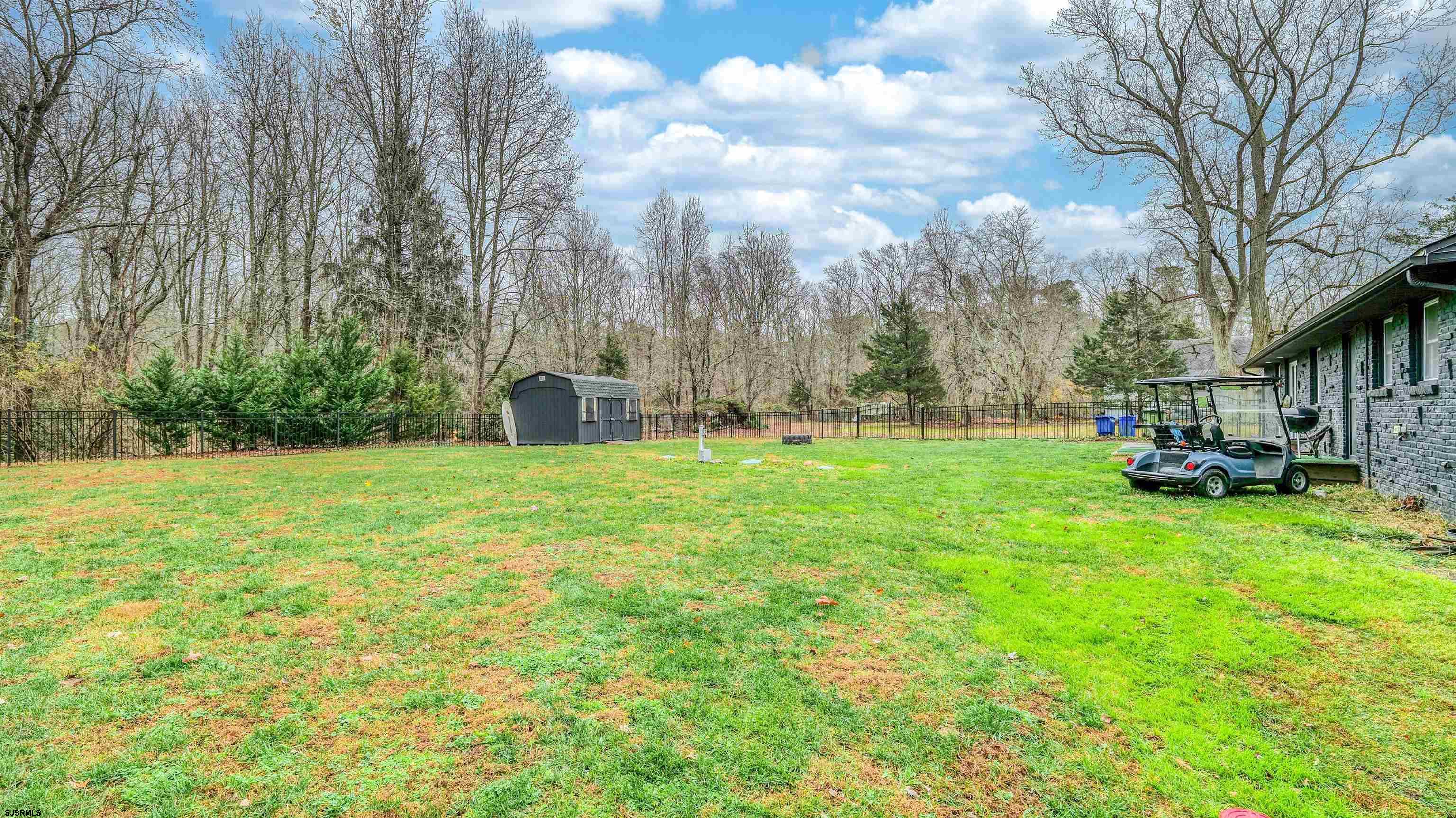 1048 Ocean Heights Avenue Egg Harbor Township, NJ 08234 - Photo 27 of 30 a view of yard with swimming pool and trees