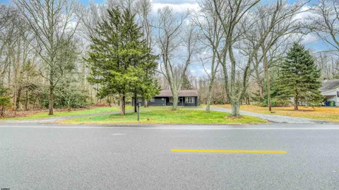 a view of pool and trees