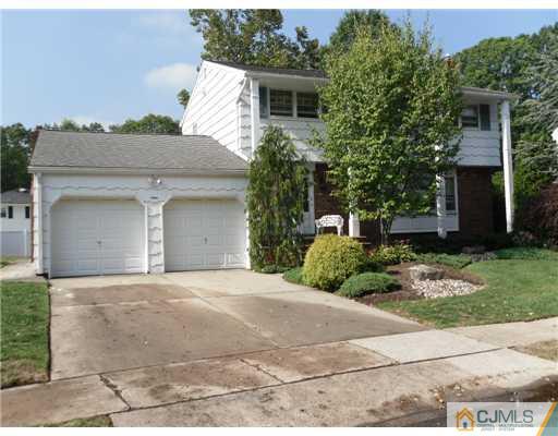 9 Bodnarik Road Edison, NJ 08837 - Photo 1 of 8 front view of a house with a yard