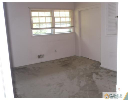 9 Bodnarik Road Edison, NJ 08837 - Photo 4 of 8 a view of a room that has a window in it