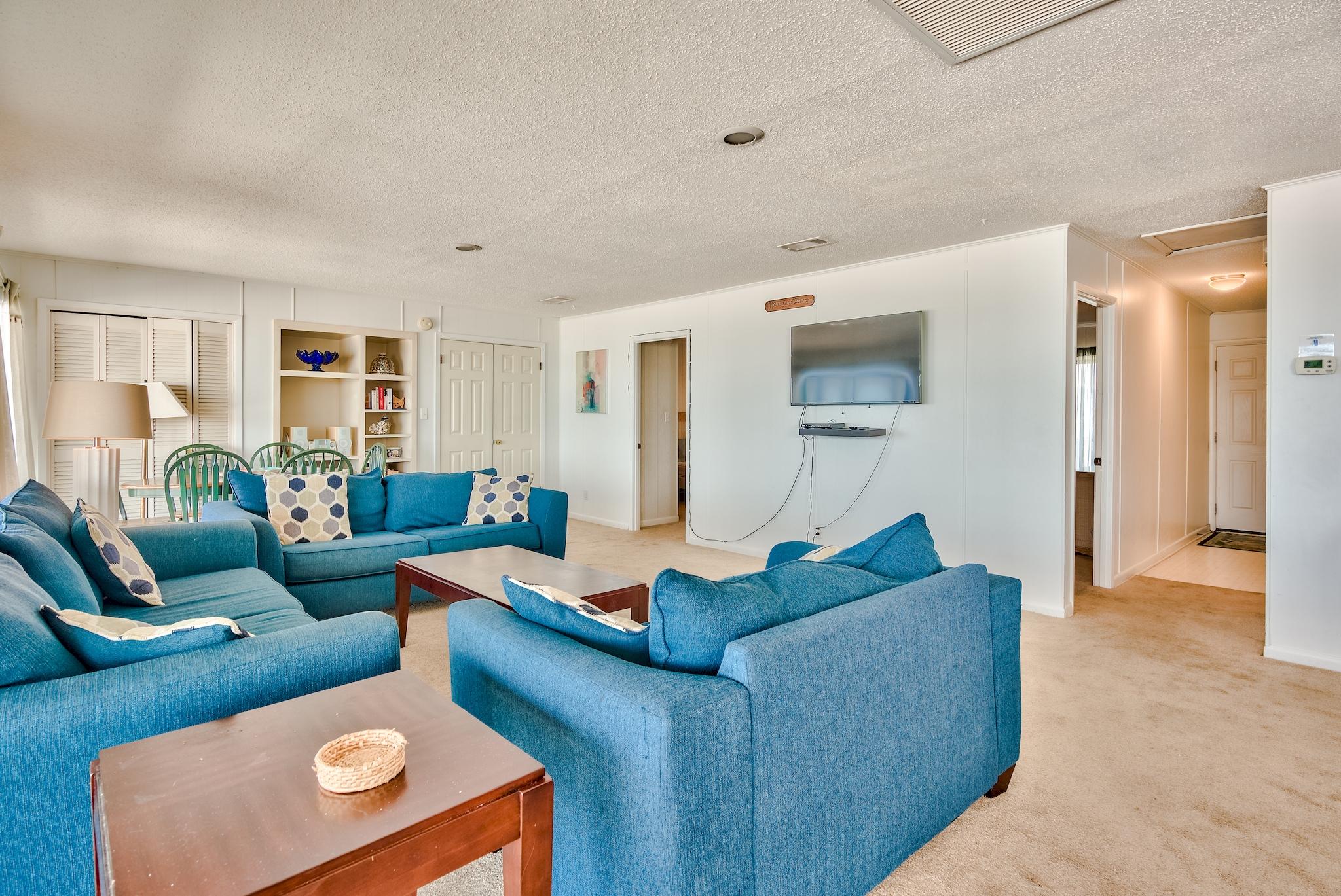 5357 West County Highway 30A Santa Rosa Beach, FL 32459 - Photo 11 of 22 a living room with furniture and a wooden floor